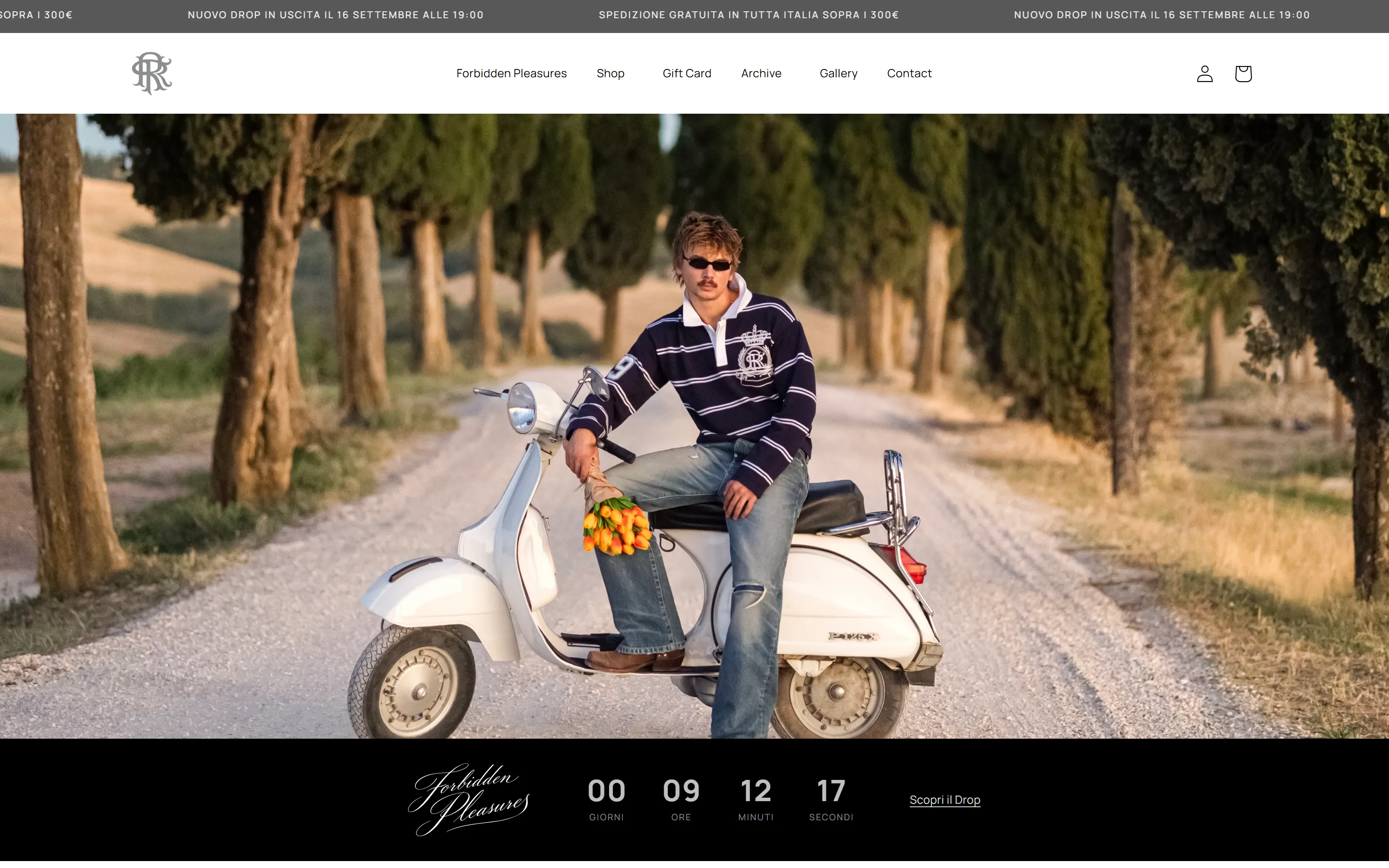Home page after the 2026 restyling: full-screen video of a young man in a striped rugby shirt on a Vespa along a cypress-lined road, with the Forbidden Pleasures drop countdown below